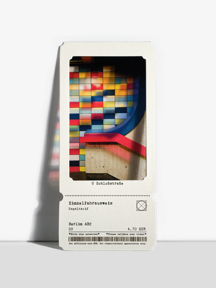 Colorful tiled Berlin U-Bahn wall with red and blue railings