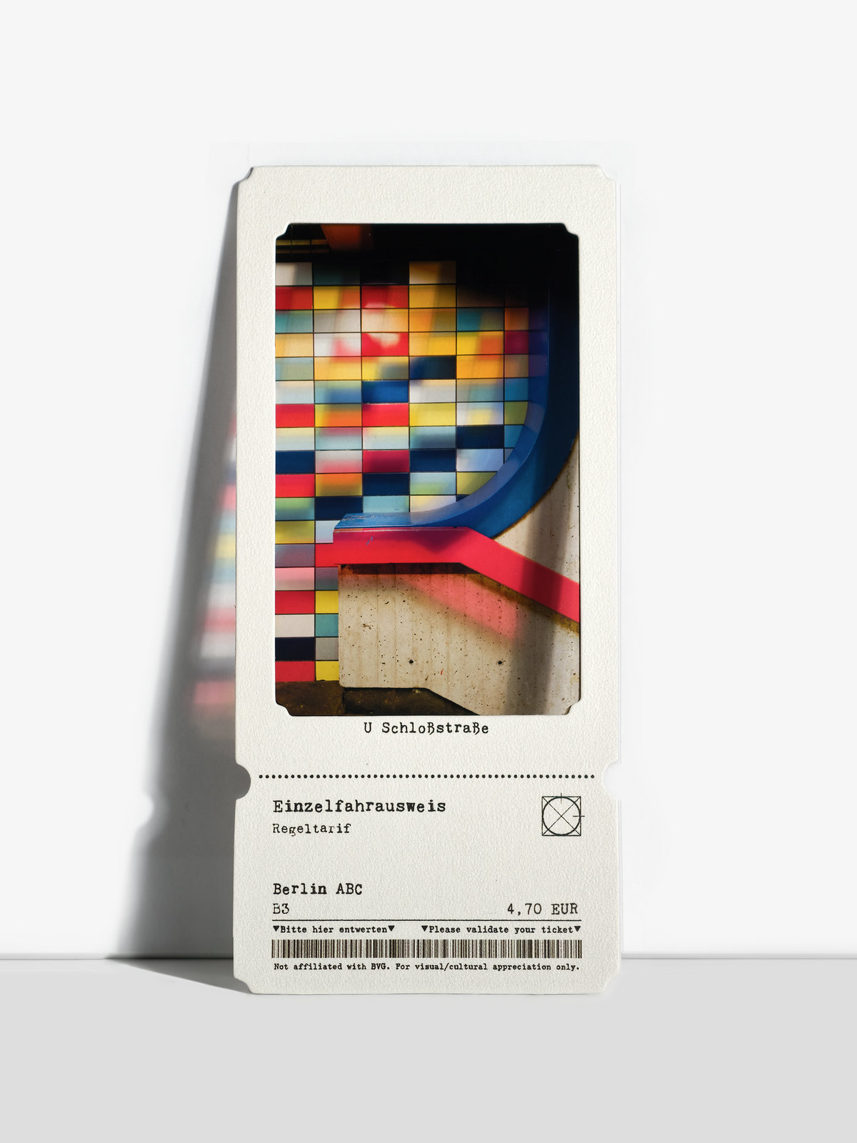 Colorful tiled Berlin U-Bahn wall with red and blue railings